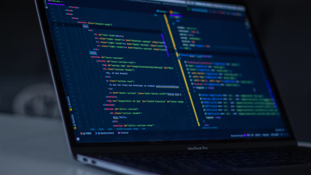 A laptop on a desk showing lines of code in a dark editor